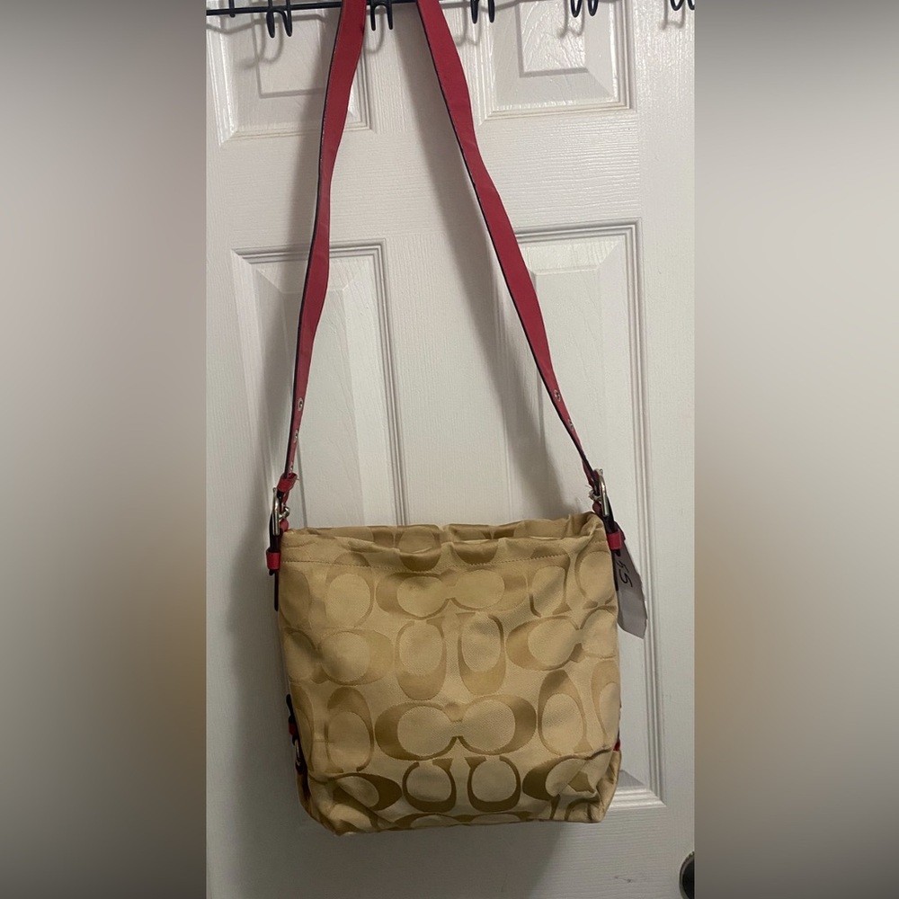 Stylish Coach Beige Crossbody Bag with Red Adjustable Strap